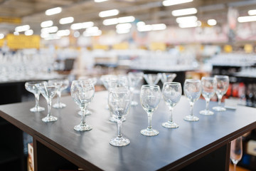 Wine glasses on the shelf closeup, houseware store