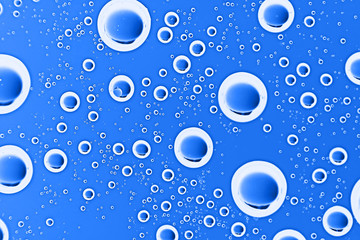 fresh drops background blue glass / wet rainy background, water drops transparent glass blue