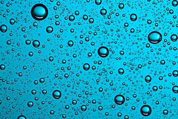 fresh drops background blue glass / wet rainy background, water drops transparent glass blue