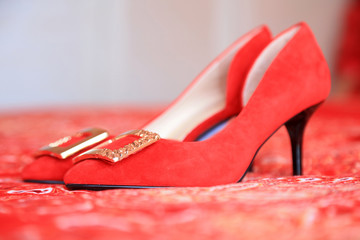 Red high heels on the carpet