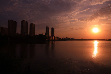 Fototapeta premium Waterfront city scenery in the evening, China