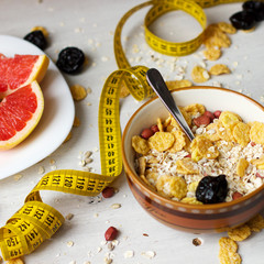 Diet breakfast. Cereals, grapefruit and dried fruits.