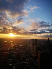 Fototapeta premium Franfurt germany 18 / 1 / 2020 panomaric view of Franfurt during sunset Capture made from the top of the scyscraper Main tower in the center of the city.