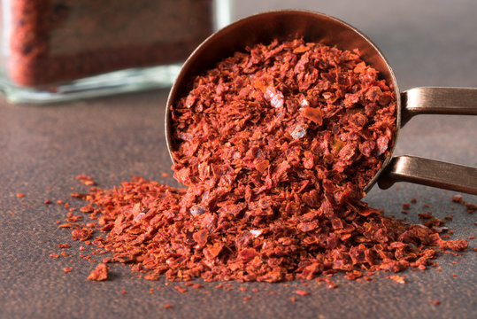 Ground Aleppo Pepper Spilled from a Teaspoon