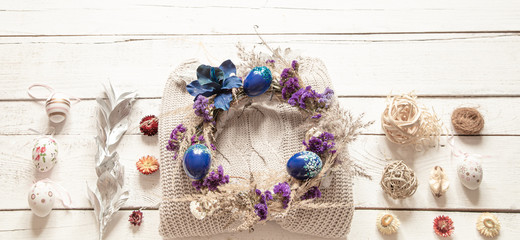 A stylish composition with the Easter wreath and eggs