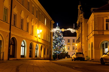 Fototapeta na wymiar Night street with christmas tree in Mikulov, South Moravia, Czech Republic.