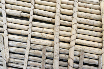 old wooden floor made of whole bamboo trunks