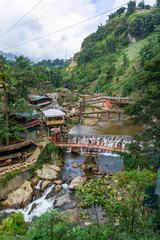 Cat Cat, Vietnam, Oct 10, 2019 Cat Cat ethnic village landscape with waterfall and tourists exploring the area