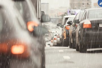 rain road traffic jam / abstract background raindrops in the city on the highway, cars stress autumn