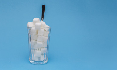 Sugar cubes on a blue background. Healthy lifestyle concept. Life without diabetes