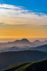 Fototapeta na wymiar Sunset in the Mountains with Fog