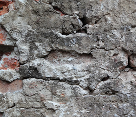 An old crumbling wall forms an irregular pattern that can be used for backgrounds.