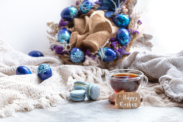 Easter Still life Breakfast with tea and dessert macaroons .