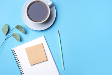 Flat lay photo of a freelancer workspace desk with copy space background. Top view.
