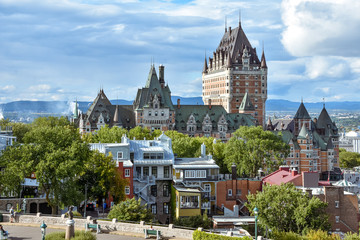 Cityscape of Quebec on a cloudy sunny day, with rainbow in the background. Concept of travel and...
