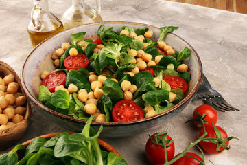 chickpea salad with ingredient and tomatoes and lamb´s lettuce. healthy salad