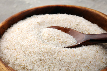 Portion of Psyllium Seeds on rustic dark background. Psyllium seed husks on wood