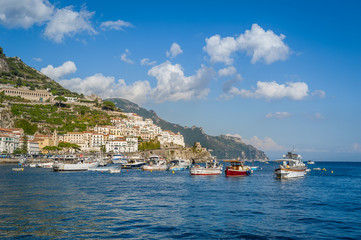 Naklejka na ściany i meble Traditional local fisherman's boats at anchor in Amalfi, Italy.