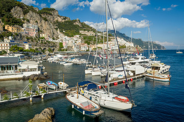 Fototapeta na wymiar Amalfi old town and harbor panorama. Popular travel attraction of Italy coast.