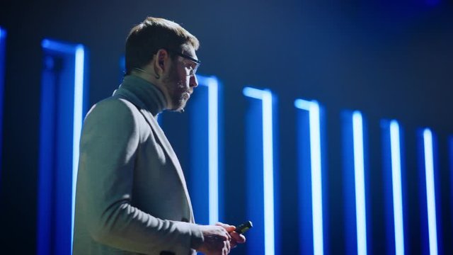 Business Conference Stage: Hardware Developer Startup CEO Presents New Product, Does Motivational Talk. Speaker does Lecture about Science, Technology, Entrepreneurship, Development, Leadership 
