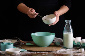 The process of making desserts. Cream cakes, muffins, cookies, groceries. The kitchen and confectioner makes desserts.