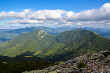 Fototapeta premium Beautiful view of the Ukrainian Carpathians from Mount Grofa on a cloudy summer day. Gorgany region, Ukraine