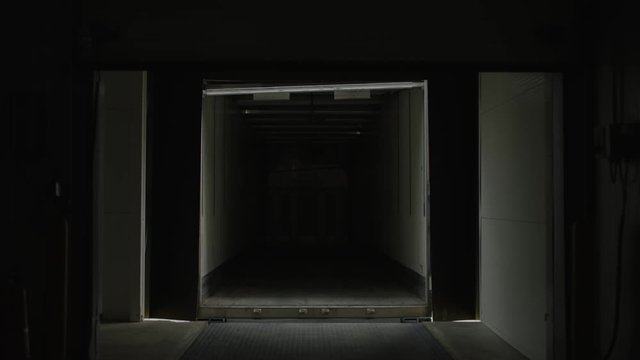 Factory Door Opening and Truck Approaching