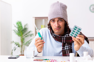 Young man suffering from flu at home