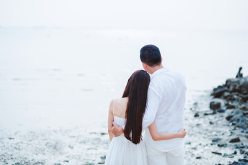 Happy Couple having sweet and romantic on the beach.