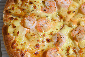 italian pizza cheese with pineapple and shrimp topping sea food