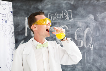 Chemist carries chemistry experiment in laboratory. Test-tubes with chemical reagent. Chemical...