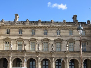 View of the Louvre Palace from within the main courtyard in Paris, France 