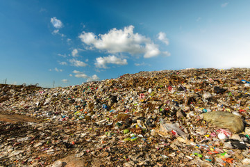 Mountain garbage in developing countries South East Asia sky blue  and the afternoon sun	