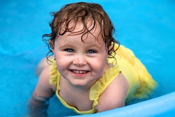 happy girl in swimming pool