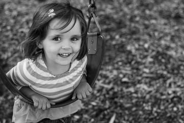 little girl on a swing