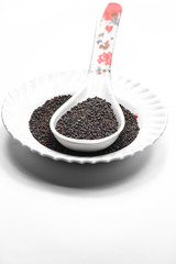 Black mustard seeds isolated on white background
