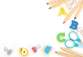 Soft English letters with school and office supplies on white background. Back to school,...