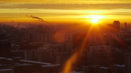 Sunrise over the city Aerial view of Moscow silhouettes of buildings Raising sun