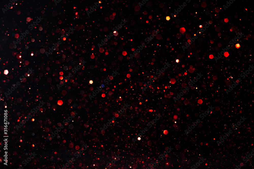 Poster beautiful bokeh on an abstract black background.