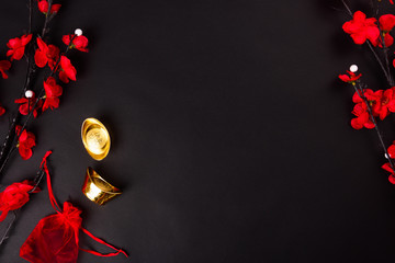 Chinese New Year, flat lay top view, gold bar and Chinese Flower