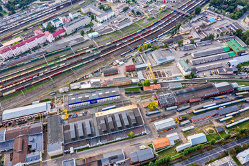 aerial top view on railway station in city. lots of freight wagons waiting for depot