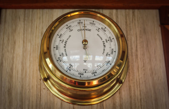 Analog barometer closeup on the navigating bridge of the ship