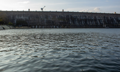 Beautiful view of the majestic Krishna Raja Sagara dam in Mysore, Karnataka, India. The lake of the KRS dam viewed from the bridge of Brindavan Gardens.