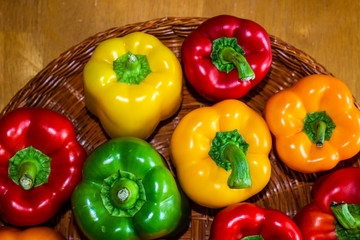 colorful fresh peppers in a basket display