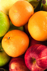 Seasonal organic raw fruit  ( red apple and banana and orange ) on  background fruit health food