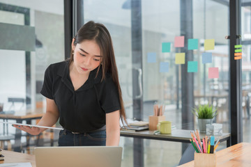 Beautiful young asian freelancer business people working with computer laptop at workplace.