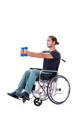 Obraz premium Young disabled man doing physical exercises isolated on white