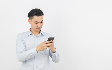Young handsome asian business man playing smartphone with smiling isolated on white background.