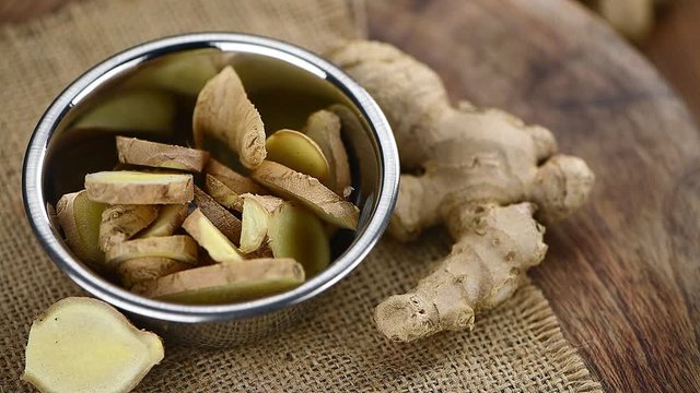 Portion of Ginger on a rotating wooden plate (close-up and seamless loopable)
