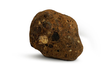 Conglomerate isolated on white background. Conglomerateis a sedimentary rock formed from rounded gravel and boulder sized clasts cemented together in a matrix.
